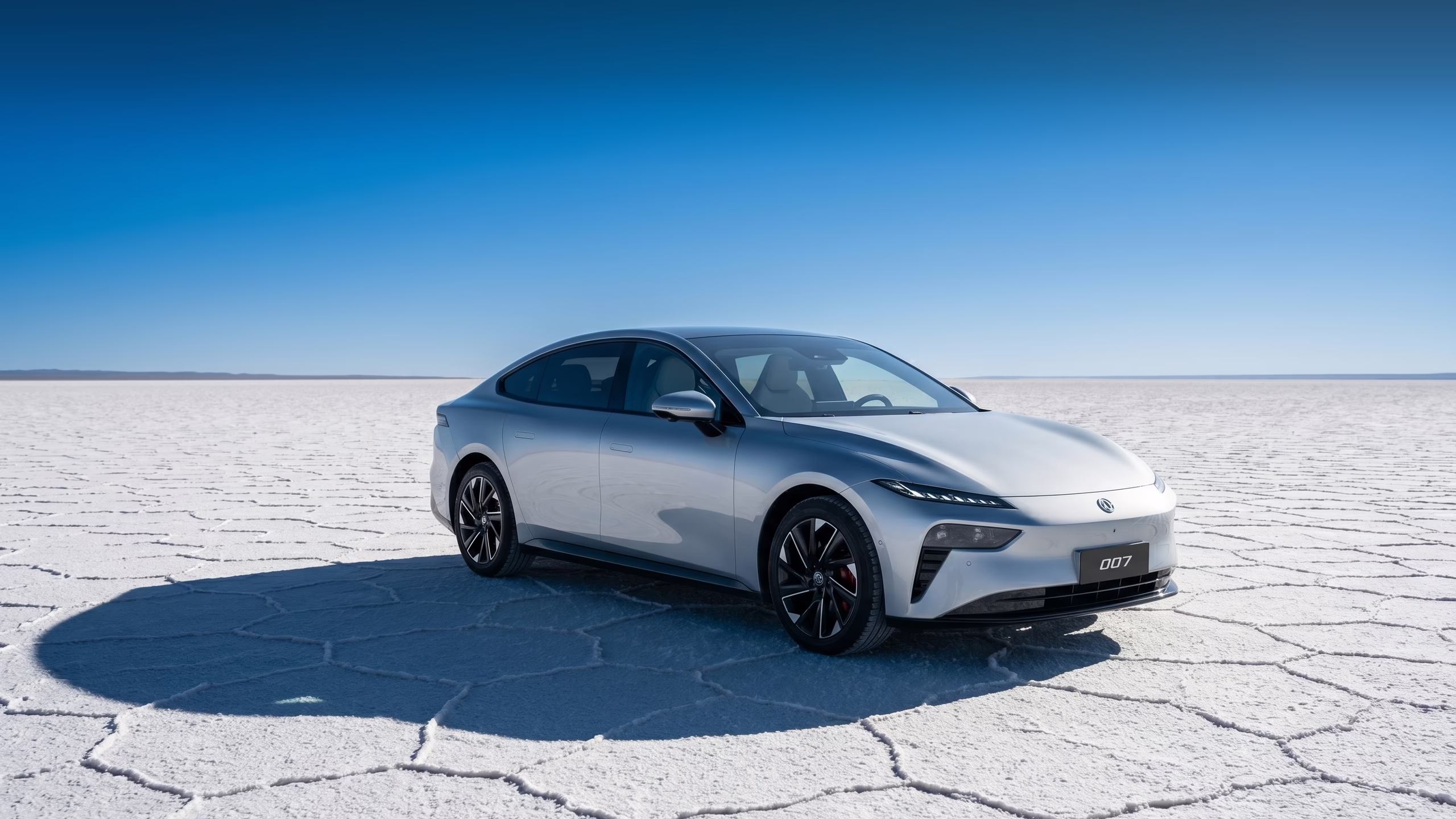 Silver Dongfeng 007 on a white salt flat under a blue sky